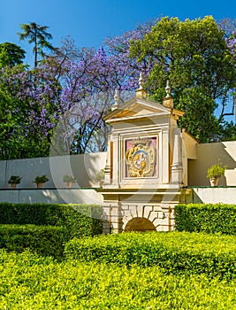 Spain Coat of Arms in garden of the Royal Alcazars of Seville, Andalusia, Spain.