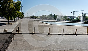 Spain, Cordoba, EMPTY ROAD BY RAILING IN CITY AGAINST CLEAR SKY