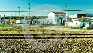 Spain, Cordoba, RAILROAD TRACKS BY BUILDINGS IN CITY AGAINST CLEAR SKY