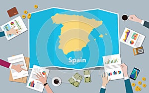 Spain economy country growth nation team discuss with fold maps view from top