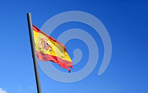 Spain flags on blue sky background. Catalonia Barcelona flag with spain and europe flag