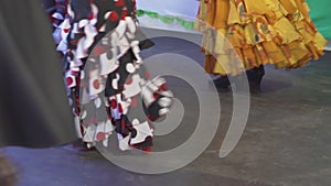 Spain - Flamenco. Women in traditional dresses dancing flamenko.