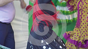 Spain - Flamenco. Women in traditional dresses dancing flamenko.