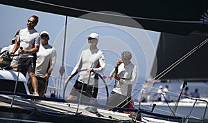 Spain king felipe steers aifos yacht during regatta wide