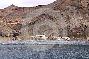 Spain La Gomera island playa la cantera abandoned fish factory from the sea photo