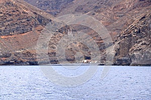 Spain La Gomera island playa la cantera abandoned fish factory from the sea photo