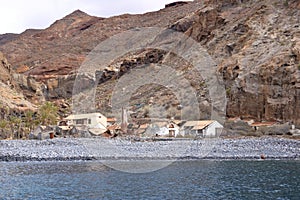 Spain La Gomera island playa la cantera abandoned fish factory from the sea photo