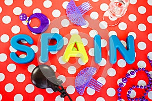 Spain made of plastic letters, castanet and costume jewelry photo