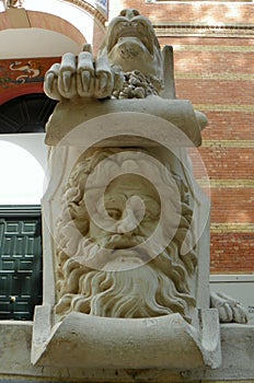 Spain, Madrid, El Retiro Park, Palacio de Velazquez, winged lion at the entrance, element of the statue
