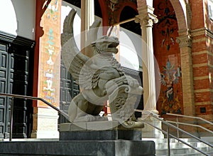 Spain, Madrid, El Retiro Park, Palacio de Velazquez (Velazquez Palace), winged lion at the entrance