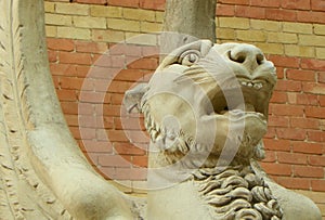 Spain, Madrid, El Retiro Park, Palacio de Velazquez (Velazquez Palace), winged lion at the entrance, head