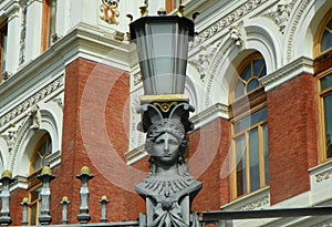 Spain, Madrid, metal streetlight with a head