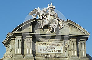 Spain, Madrid, Plaza de la Independencia, Puerta de Alcala, coat of arms on top of the building photo