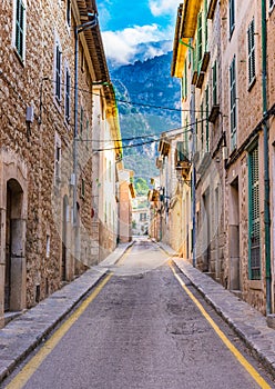 Spain Majorca, narrow street with rustic houses of Soller village