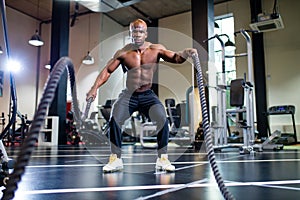 spain man in white cotton t-thirt wearing mask while working out in gym