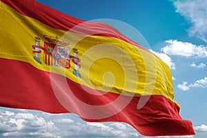 Spain national flag waving blue sky background realistic 3d illustration
