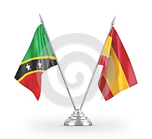 Spain and Saint Kitts and Nevis table flags isolated on white 3D rendering