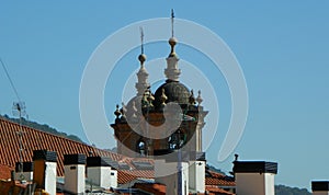 Spain, San Sebastian, 6 Gaztelubide Kalea, spiers of the Basi­lica de Santa Mari­a del Coro and the roofs of buildings