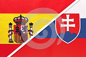 Spain and Slovakia, symbol of two national flags from textile. Championship between two european countries