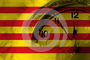 Spain, Spanish, Catalonia, Senyera flag with clock close to midnight in the background. Happy New Year concept