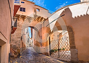 Spain, street in historic city center with gate of Almudaina in Palma de Majorca