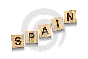 Spain, word on wooden blocks. Isolated on a white background