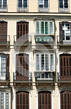 Spain â€“ Malaga.  An elegant facade of a turn of the century city building.