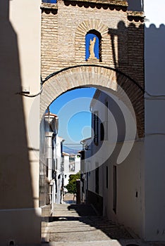 Archway in the old town, Estepa, Spain. photo