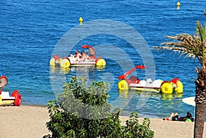 Tourists on pedalos, Benalmadena, Spain.