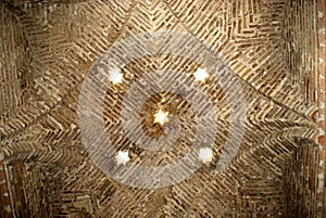 Ceiling detail with star shaped skylights inside the Arab Baths, Jerez de la Frontera, Spain. photo