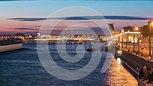 Span of the Liteyny Bridge is lifted over the river Neva timelapse