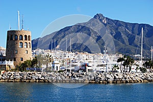 Harbour watchtower and town at Puerto Banus, Marbella.