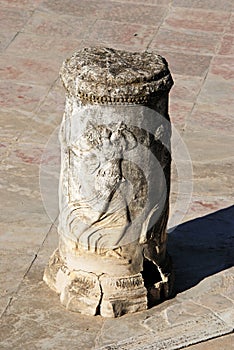 Ornate Roman column, Santiponce, Spain. photo