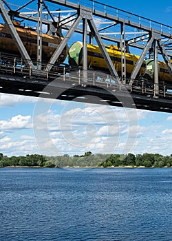 The span of the railroad bridge with freight train on it