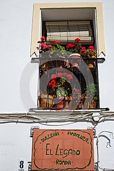 Pretty balcony with iron work grills, Ronda, Spain.