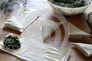 Spanakopita, preparing traditional Greek spinach pie.