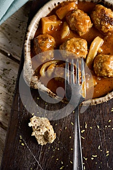 Spanish albondigas con sepia, meatballs with cuttlefish photo