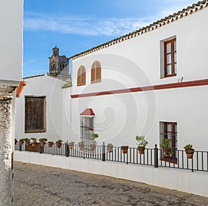 Spanish architecture style buildings with whitewashed walls and flower pots