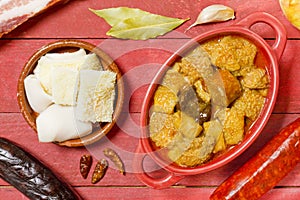 Spanish callos on a red bowl