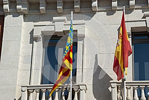 Spanish and Catalonian Flag next to each other on balcony