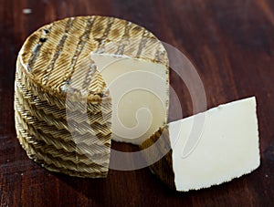 Spanish cheese mezclado with cut slice photo