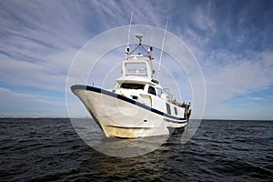 Trawler fishing boat ready to use nets. photo