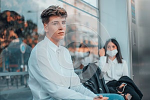 Spanish couple wearing facemask at a bus station