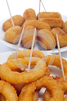 Spanish croquettes and calamares a la romana, squid rings photo