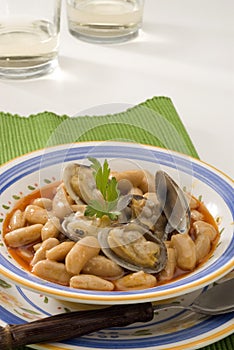 Spanish Cuisine. Asturian clams and beans. photo