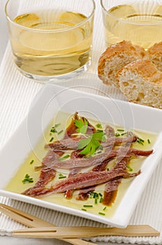 Spanish Cuisine. Marinated anchovies. Anchoas en aceite. photo