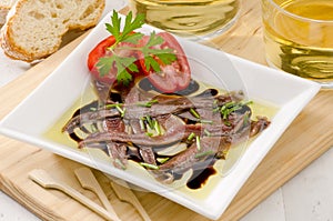 Spanish Cuisine. Marinated anchovies. Anchoas en aceite. photo