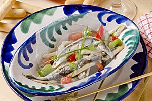 Spanish Cuisine. Marinated fresh anchovies. Boquerones. photo