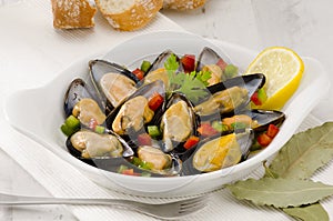 Spanish Cuisine. Mussels in Sauce. Mejillones a la Marinera. photo