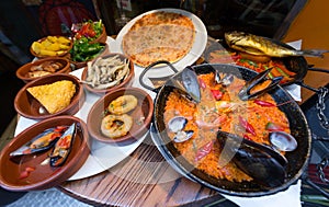 Spanish cuisine, tapas and seafood paella